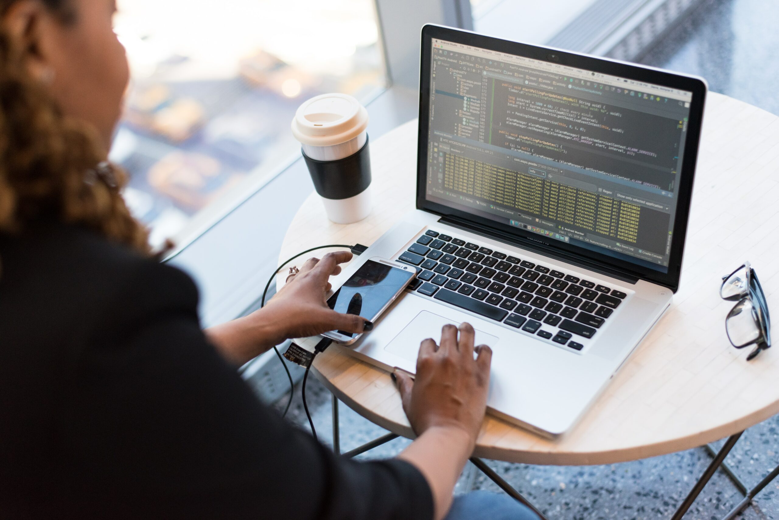 Woman coding on her laptop